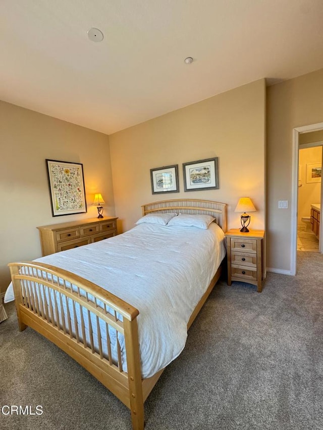 bedroom featuring dark carpet