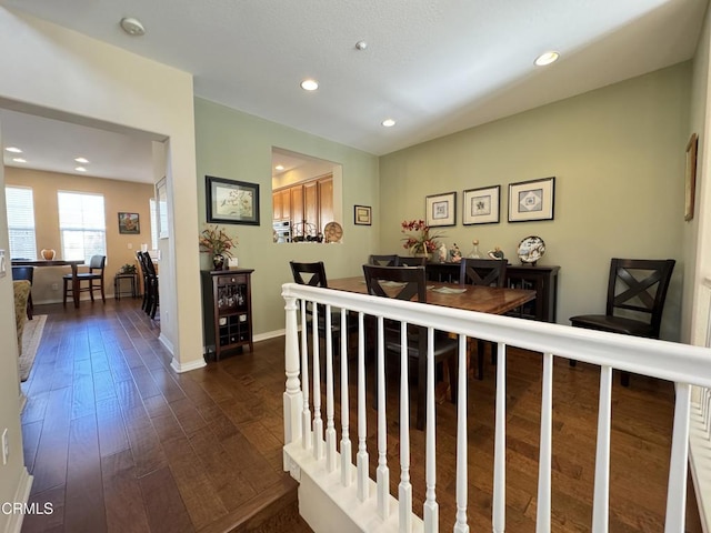 hallway with dark wood-type flooring