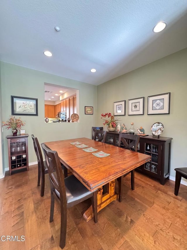 dining room with hardwood / wood-style flooring