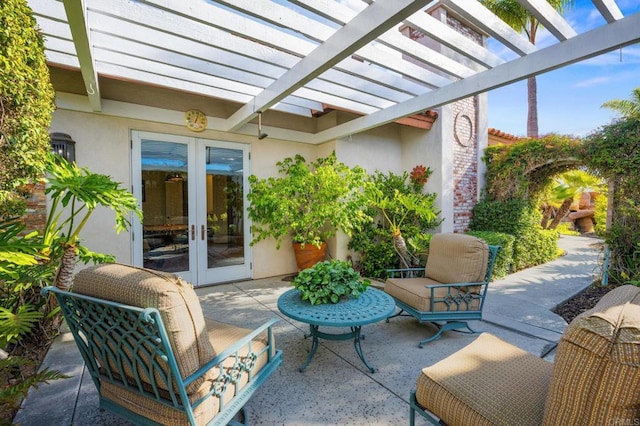 view of patio / terrace with a pergola and french doors