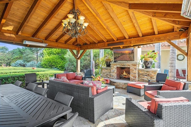 view of patio / terrace with a gazebo and an outdoor living space with a fireplace