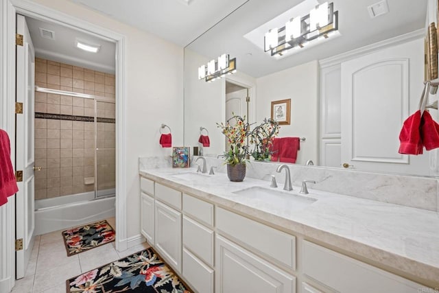 bathroom with tile patterned flooring, vanity, and shower / bath combination with glass door