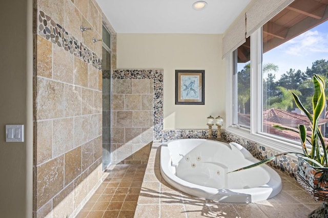 bathroom featuring shower with separate bathtub