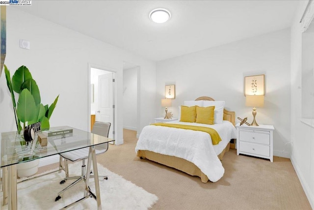 bedroom featuring light colored carpet