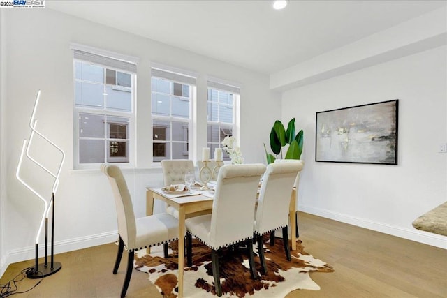 dining area featuring wood-type flooring