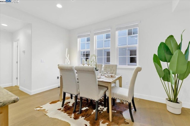 dining space featuring light hardwood / wood-style flooring