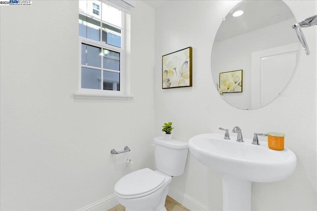 bathroom featuring sink and toilet