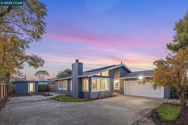 ranch-style home featuring a garage