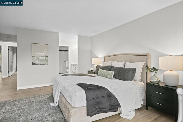 bedroom with hardwood / wood-style floors