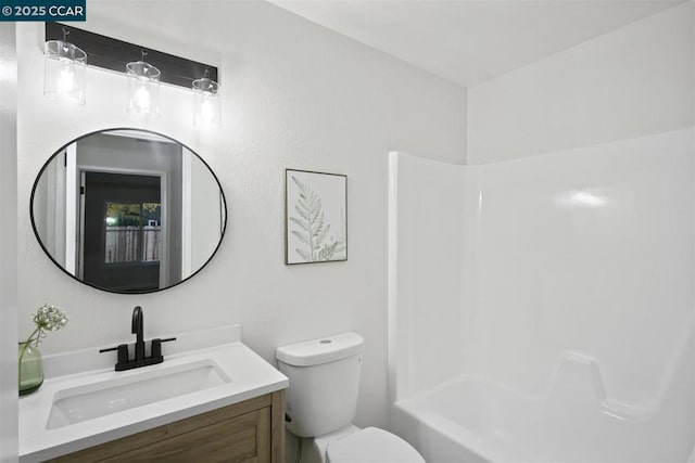 full bathroom with vanity, toilet, and  shower combination