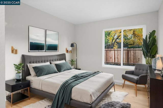 bedroom with light hardwood / wood-style floors