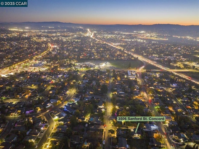 aerial view at dusk with a mountain view