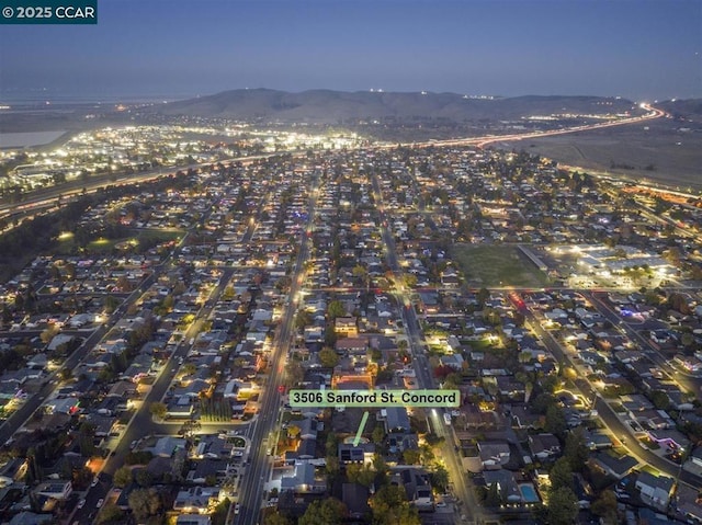 aerial view at dusk with a mountain view