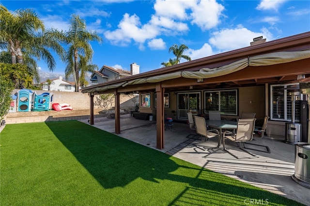 exterior space featuring a yard and a patio area