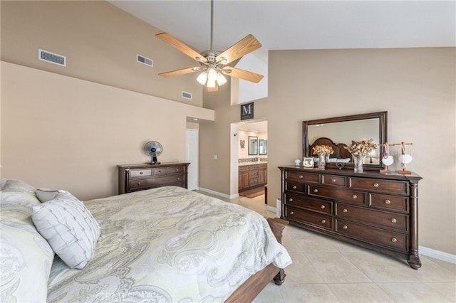 tiled bedroom featuring ceiling fan, ensuite bathroom, and high vaulted ceiling