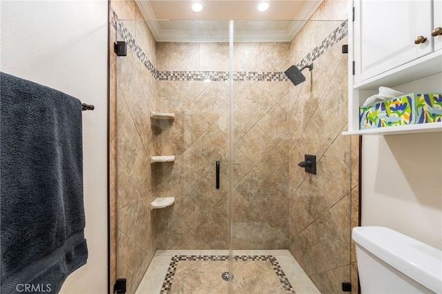 bathroom featuring crown molding, toilet, and an enclosed shower