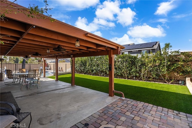 view of patio featuring ceiling fan