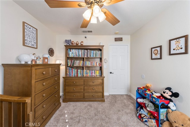 bedroom with ceiling fan and light colored carpet