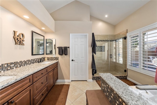 bathroom featuring lofted ceiling, an enclosed shower, vanity, tile patterned flooring, and decorative backsplash