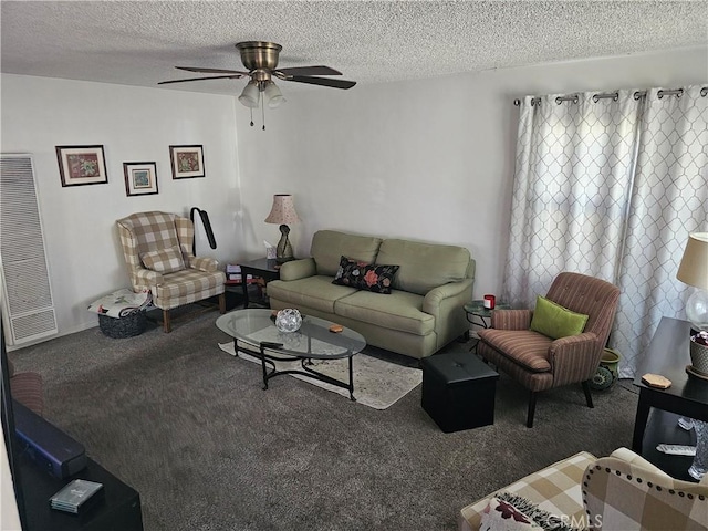 carpeted living room with ceiling fan and a textured ceiling