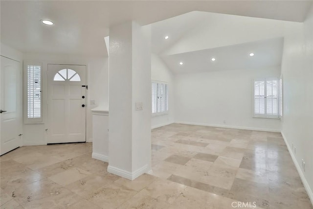 entrance foyer featuring lofted ceiling and a healthy amount of sunlight