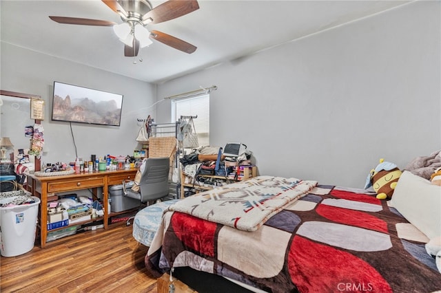 bedroom with hardwood / wood-style flooring and ceiling fan