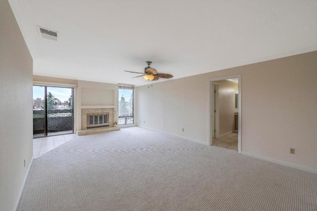 unfurnished living room featuring ceiling fan and light carpet