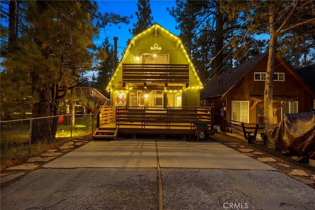 view of front facade with a wooden deck