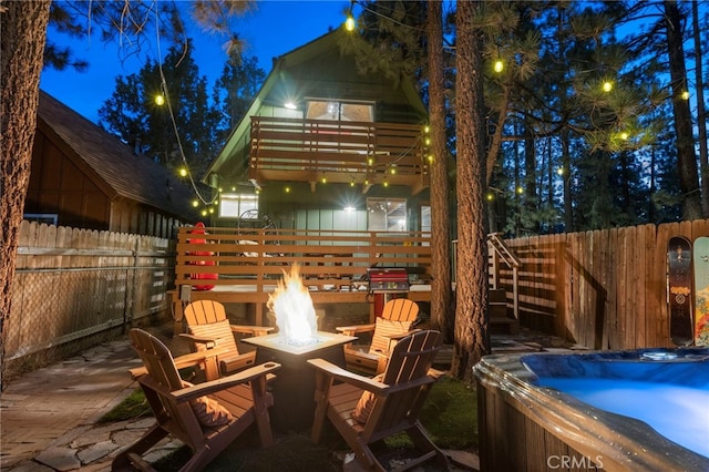 patio at night with an outdoor fire pit