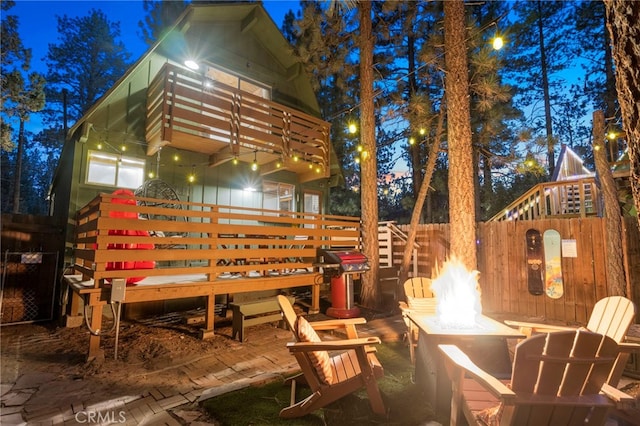 deck featuring a grill and a fire pit