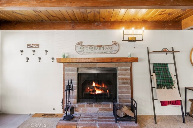 details featuring beam ceiling, wooden ceiling, and a fireplace