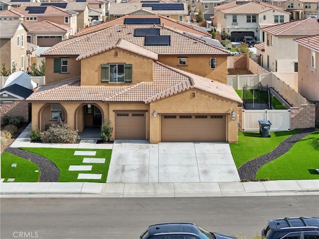 view of front of property featuring a front lawn and solar panels