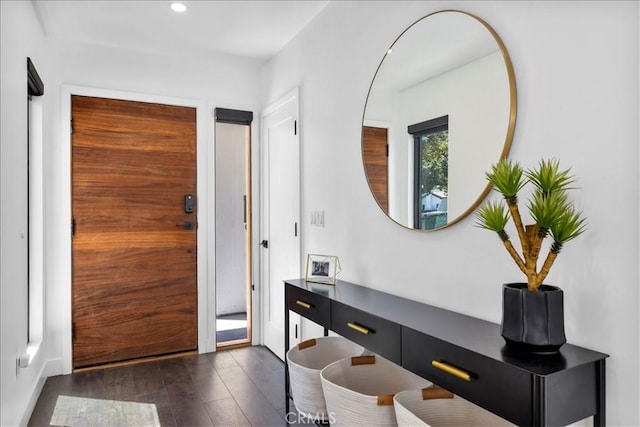 doorway to outside featuring recessed lighting and dark wood-style flooring