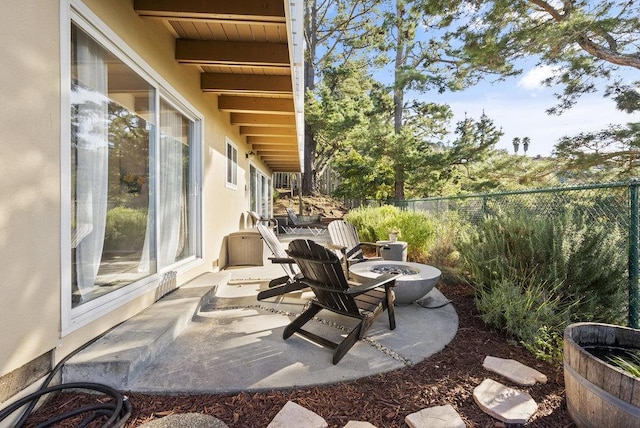 view of patio / terrace with a fire pit