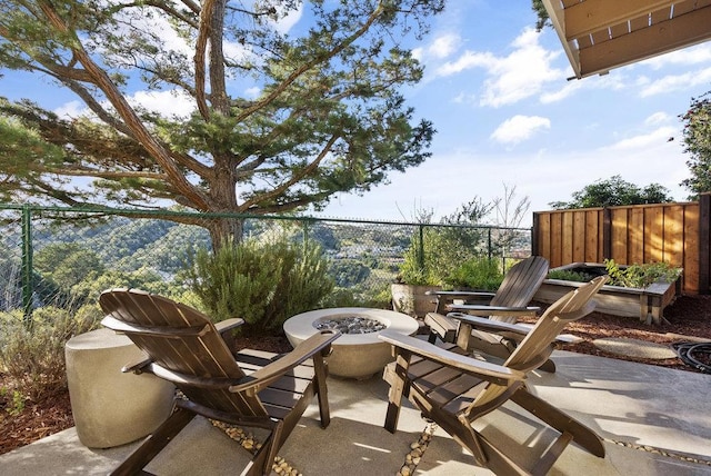 view of patio / terrace with an outdoor fire pit