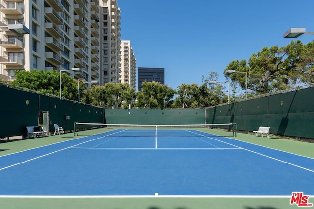 view of sport court with basketball hoop