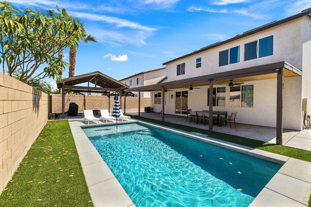 view of swimming pool with a gazebo, a patio, and ceiling fan