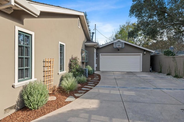 view of side of home with a garage