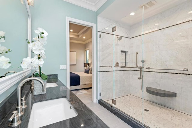 bathroom with crown molding, walk in shower, tile patterned flooring, and sink