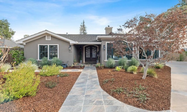 single story home featuring french doors