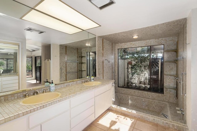 bathroom featuring tile patterned flooring and vanity