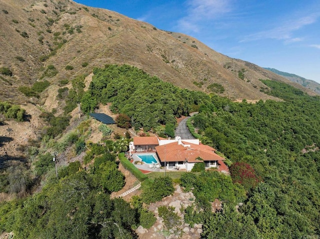 birds eye view of property with a mountain view