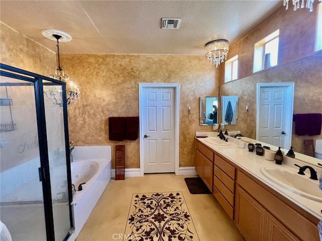 bathroom with independent shower and bath, vanity, a textured ceiling, and an inviting chandelier