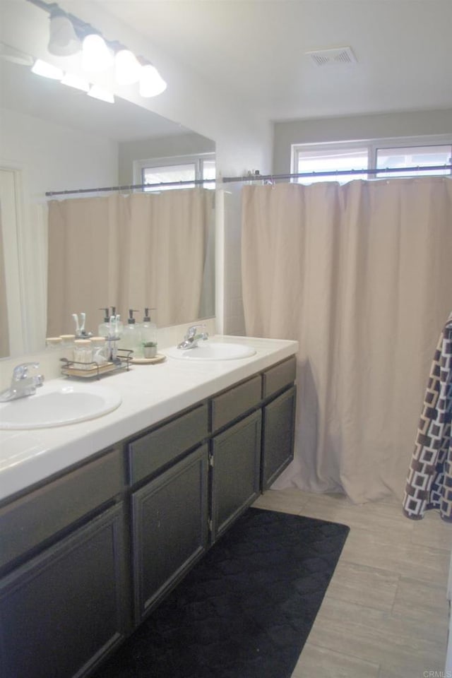 bathroom with vanity and tile patterned floors