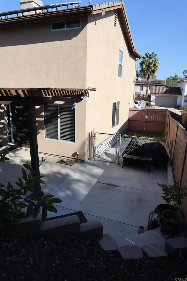 rear view of house featuring a patio area