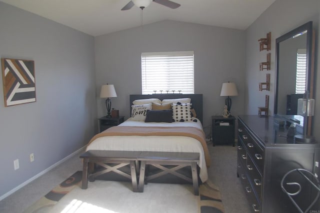 carpeted bedroom featuring lofted ceiling, multiple windows, and ceiling fan