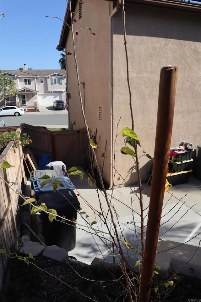 view of side of property with a patio area