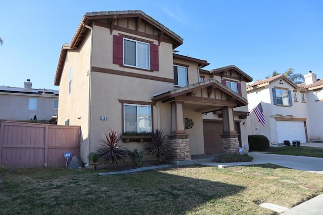 view of front of property featuring a garage and a front lawn