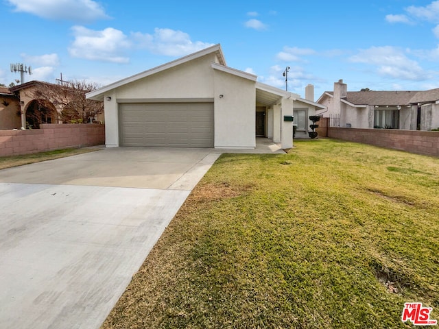 ranch-style home with a garage and a front yard