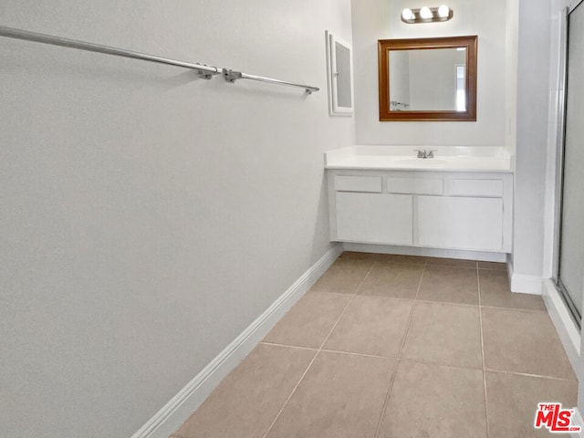 bathroom with vanity and tile patterned floors